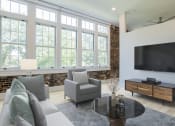 Thumbnail 40 of 46 - a living room with a couch and a coffee table at The Mobile Lofts, Alabama