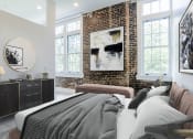 Thumbnail 42 of 46 - a bedroom with a bed and a brick wall at The Mobile Lofts, Alabama