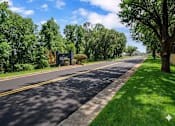 Thumbnail 2 of 19 - A street with a sign that says "ILLINOIS" on it.