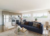 Thumbnail 3 of 46 - a living room with a blue couch and a kitchen in the background at The Mobile Lofts, Alabama, 36604