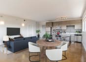 Thumbnail 2 of 46 - a living room and kitchen with a table and chairs at The Mobile Lofts, Alabama