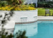 Thumbnail 20 of 32 - a swimming pool in a backyard with a patio and chairs at Dothan Farms, Dothan, Alabama