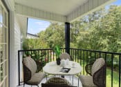 Thumbnail 28 of 32 - a patio with a table and chairs on a balcony at Dothan Farms, Dothan, AL, 36305