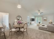 Thumbnail 25 of 32 - a living room with a table and chairs and a ceiling fan at Dothan Farms, Dothan