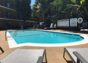 Thumbnail 31 of 39 - Woodman Lassen Apartments pool area with lounge chairs