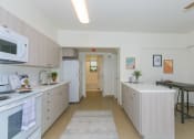 Thumbnail 18 of 38 - Kanekapolei Collection Dining and Kitchen area with decor