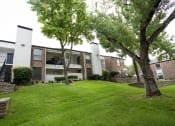 Thumbnail 40 of 47 - our apartments offer a green lawn and trees for residents to enjoy