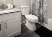 Thumbnail 30 of 47 - a bathroom with a shower and a toilet and a sink