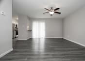 Thumbnail 19 of 47 - an empty living room with a ceiling fan