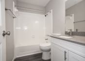 Thumbnail 18 of 47 - an empty bathroom with a sink toilet and shower