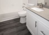 Thumbnail 20 of 47 - a bathroom with a sink and a toilet and a bath tub