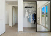 Thumbnail 19 of 38 - Kanekapolei Collection Bedroom with mirror doors on the Closet