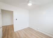 Thumbnail 15 of 23 - A room with a white ceiling and a white door.