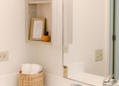 Thumbnail 27 of 38 - Kanekapolei Collection Bathroom Vanity, sink, and mirror with decor