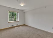Thumbnail 46 of 46 - an empty room with carpet and a window