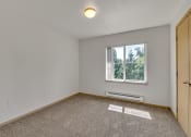 Thumbnail 41 of 46 - an empty room with a window and a door