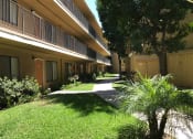 Thumbnail 36 of 39 - Woodman Lassen Apartments exterior lawn and pathway