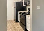 Thumbnail 19 of 22 - El Castillo Apartments kitchen area