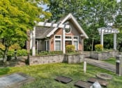 Thumbnail 2 of 46 - the front of a house with a yard and a patio