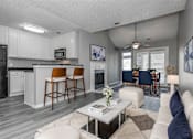 Thumbnail 27 of 47 - A modern kitchen with white cabinets and a bar area.