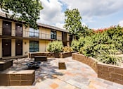 Thumbnail 4 of 41 - LaVita on Lovers Lane exterior building, outdoor fire pit, and patio seating area