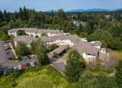 Thumbnail 1 of 46 - a aerial view of a large building surrounded by trees