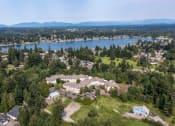 Thumbnail 3 of 46 - an aerial view of a neighborhood with a lake in the background