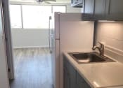 Thumbnail 12 of 17 - Aloha Kai Kitchen view into Living Room