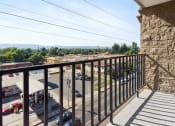 Thumbnail 17 of 17 - a balcony with a view of a parking lot