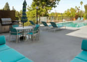 Thumbnail 4 of 17 - our apartments have a pool and a patio with furniture