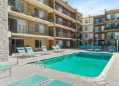 Thumbnail 14 of 17 - a swimming pool in the middle of an apartment building