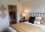 Thumbnail 7 of 24 - a bedroom with a bed and a closet