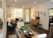 Thumbnail 1 of 24 - a living room with a couch and a table