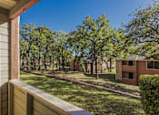 Thumbnail 4 of 20 - the view from the deck of a house with a yard and trees