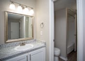 Thumbnail 19 of 20 - Bedford Oaks Apartments sink and bathroom