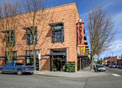 Thumbnail 2 of 25 - A brick building with a sign that says "NORTH" on it.