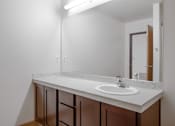 Thumbnail 25 of 25 - A white sink in a white and brown bathroom.