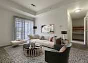 Thumbnail 11 of 22 - A living room with a grey carpet and a white sofa.