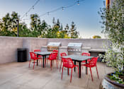 Thumbnail 26 of 28 - The Harrington barbecue area and outdoor dining tables