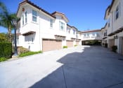 Thumbnail 13 of 35 - Parkside Villas exterior building driveway and garages
