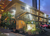 Thumbnail 6 of 37 - Moana Vista Apartments exterior building and signage at night