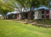 Thumbnail 12 of 22 - El Castillo Apartments yard and exterior building