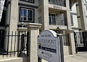 Thumbnail 20 of 20 - A sign for the Waterfront Apartments is in front of a building.