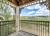 Thumbnail 16 of 30 - A balcony with a view of the mountains.