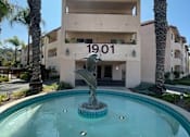 Thumbnail 1 of 16 - Hacienda Senior Villas front entrance fountain