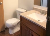 Thumbnail 15 of 20 - The Waterfront Apartments at Kahului bathroom sink, mirror, vanity, and toilet