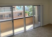 Thumbnail 18 of 24 - Seaview Apartments living room with balcony