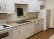 Thumbnail 10 of 17 - Irvine Inn communal kitchen