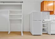 Thumbnail 17 of 19 - Kahakai Apartments kitchen and storage