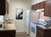 Thumbnail 6 of 19 - Hampton Court Apartments kitchen area
